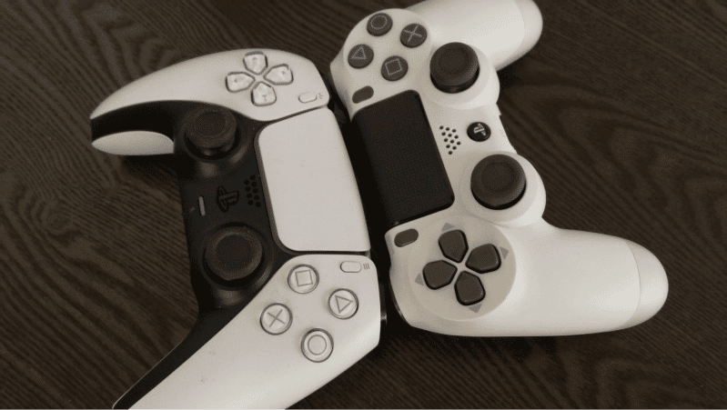 Two White PlayStation Controllers